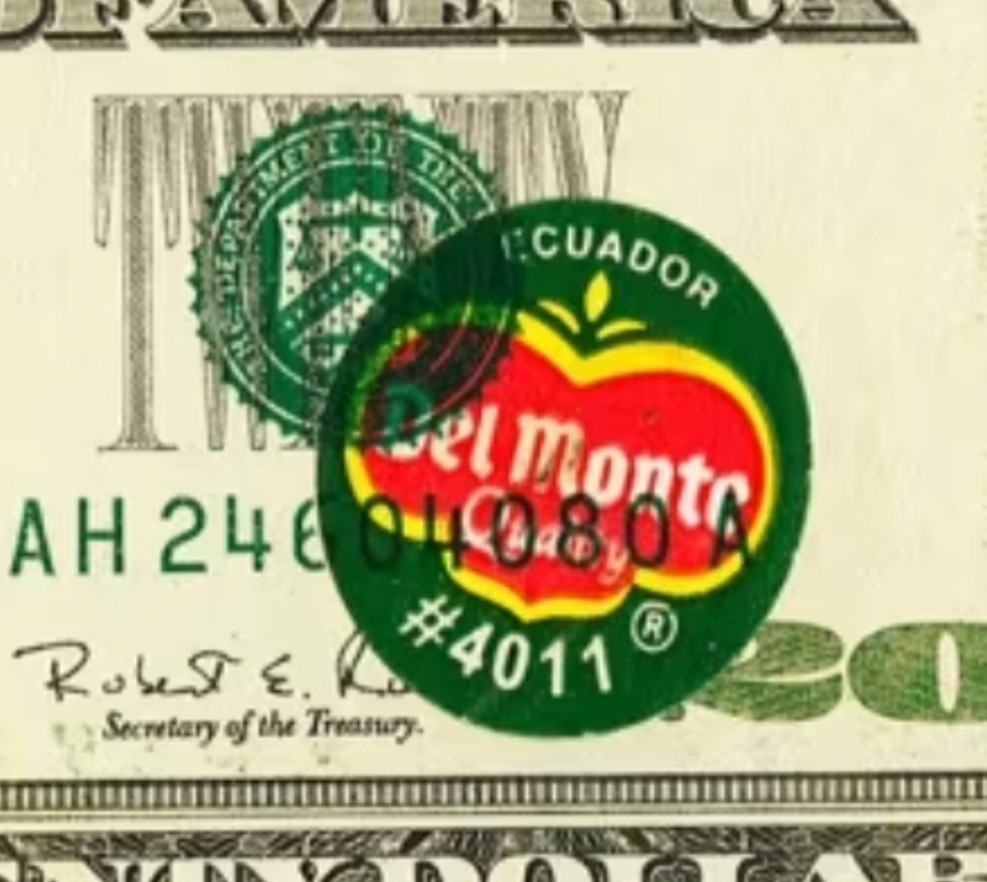 Close-up of the Del Monte sticker printed beneath the green Treasury seal on the 1996 $20 note